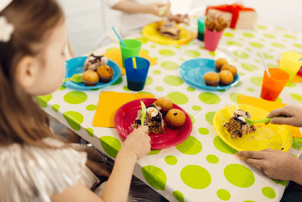 A table with snacks, cookies, and mugs of cocoa