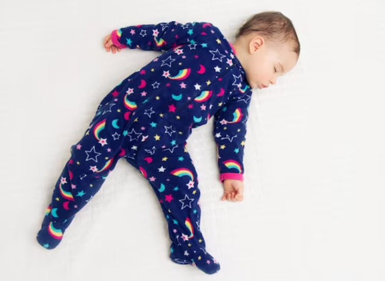 Child in footed pajamas