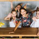 Kids-laughing-and-sitting-inside-a-homemade-fort-scaled