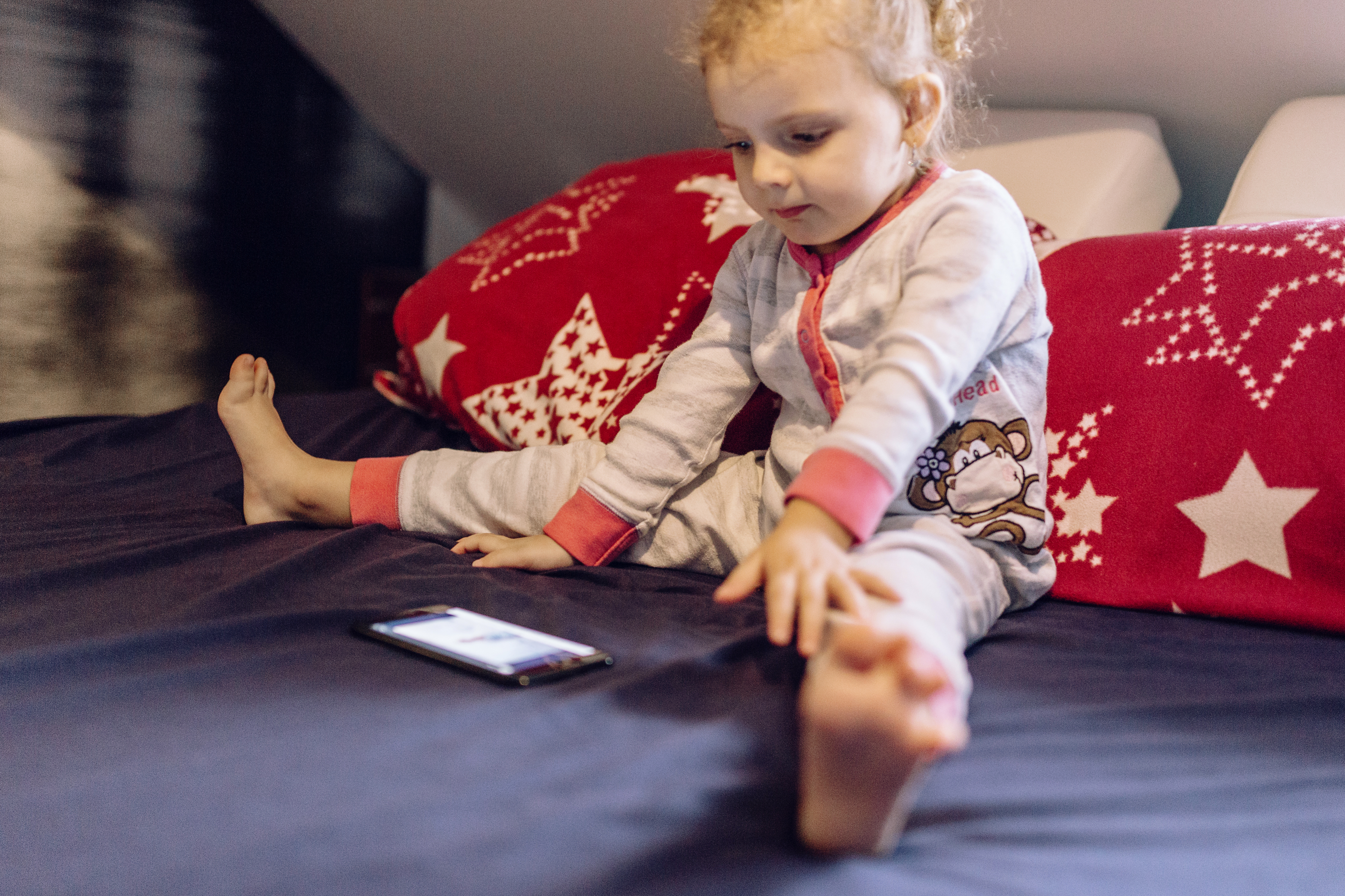 A child adjusting a comfy elastic waistband on their pajama bottoms..jpg