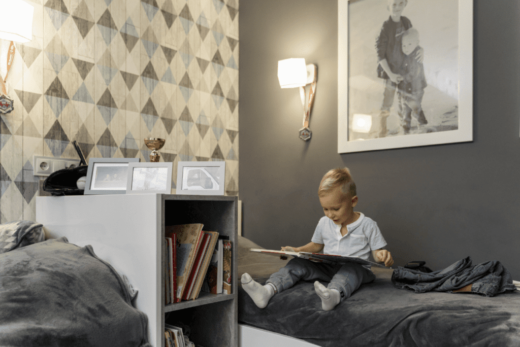 A child eagerly selecting a book from a bedtime story collection