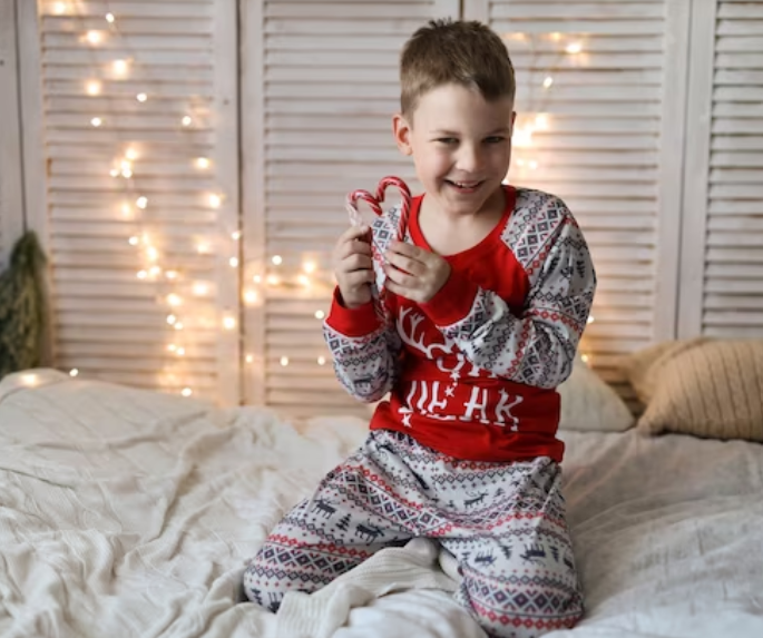 A child in a cozy all-in-one pajama with Nordic designs