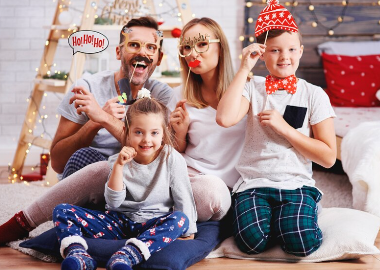 A family wearing matching striped pajamas, enjoying a group activity