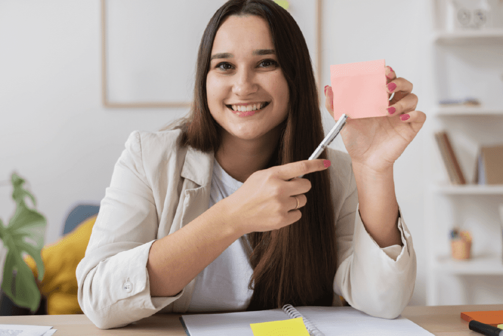 A happy seamstress at work with a note, Fair Wages