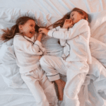 A pair of pure cotton pajamas spread out on a bed