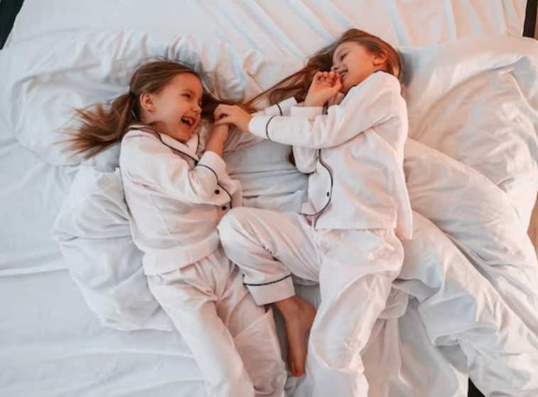 A pair of pure cotton pajamas spread out on a bed