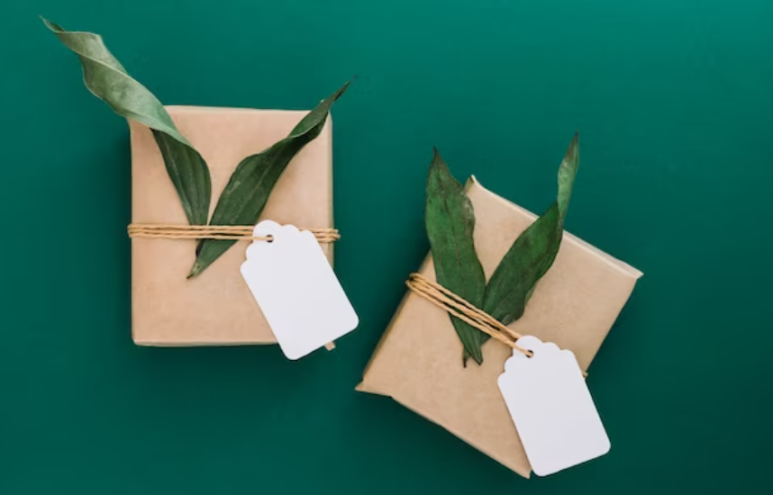 A pajama set neatly wrapped in recyclable brown paper with a green leaf sticker