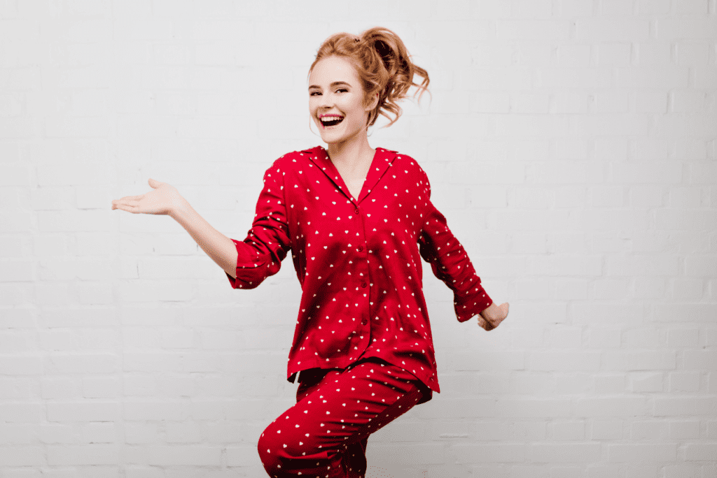 A young girl in vibrant Ankara fabric pajamas