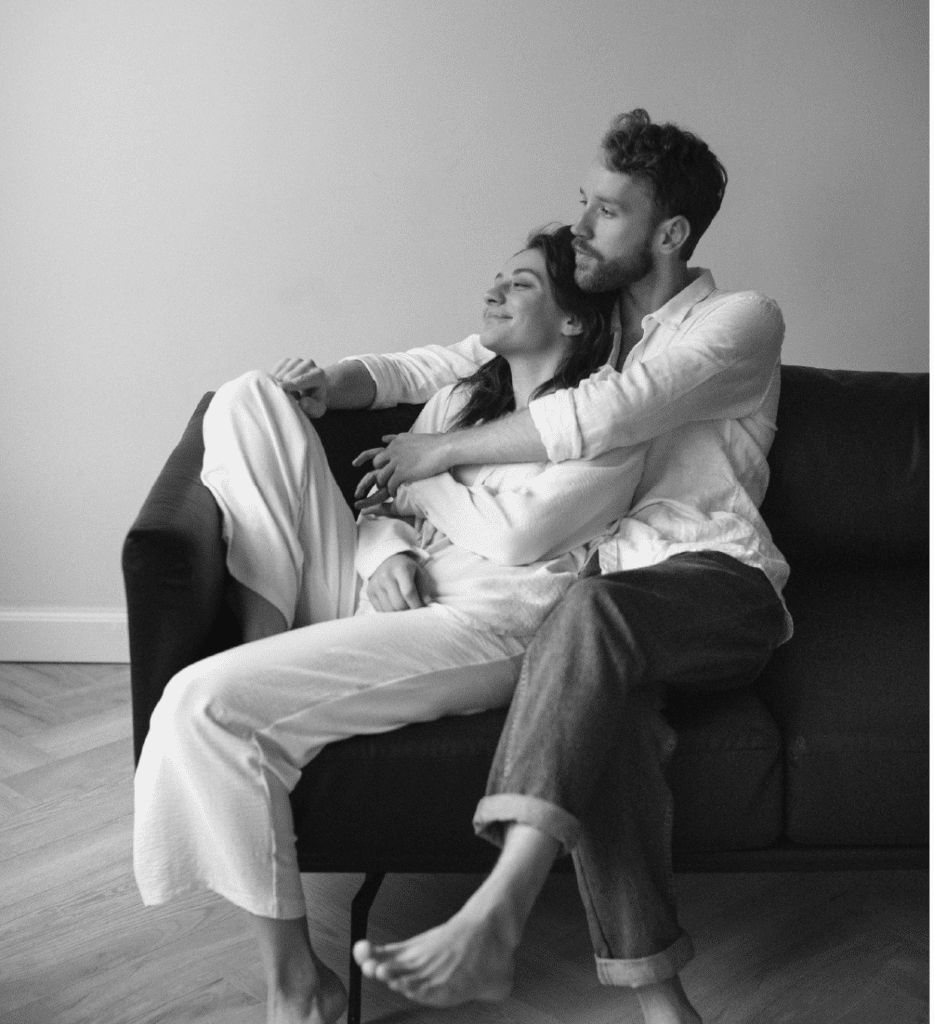 A couple wearing matching pajama sets