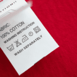 Close-up of a fabric tag showing 100% cotton