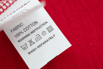 Close-up of a fabric tag showing 100% cotton