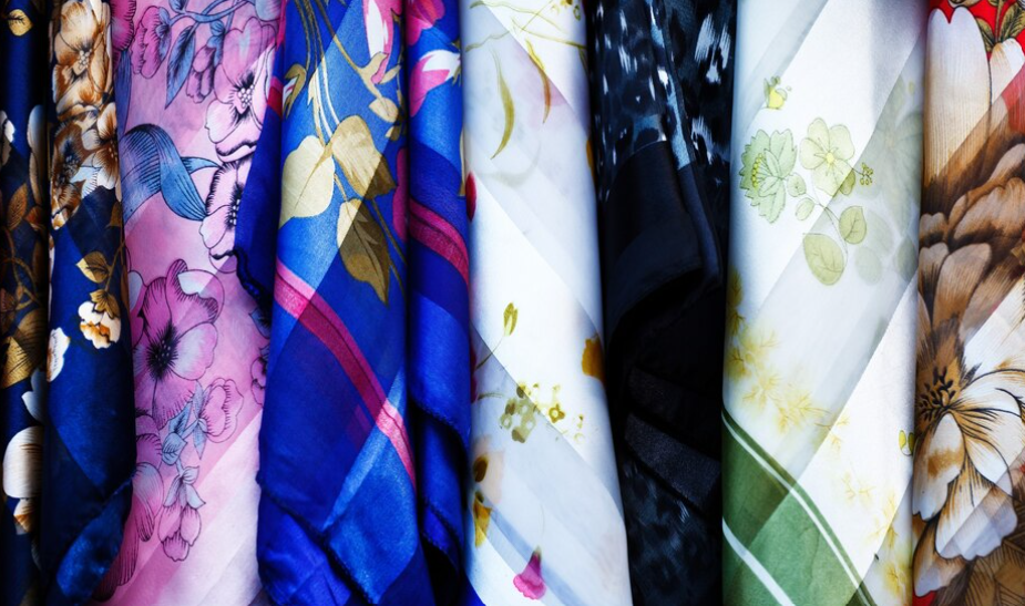 Close-ups of various pajama fabrics - silks, cottons, and playful patterns.