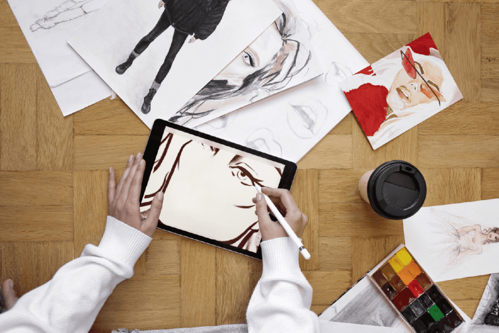 Designer sketches next to popular fashion magazines