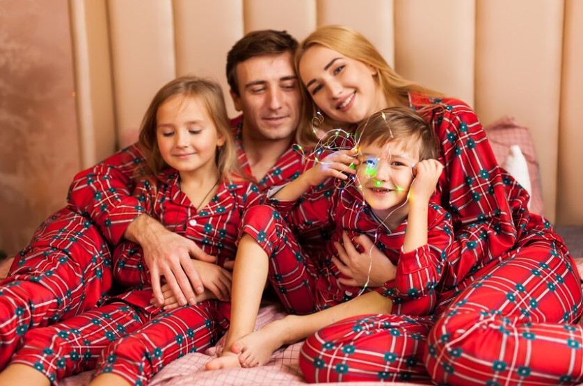 Early 20th-century photo of a family in matching two-piece pajamas.