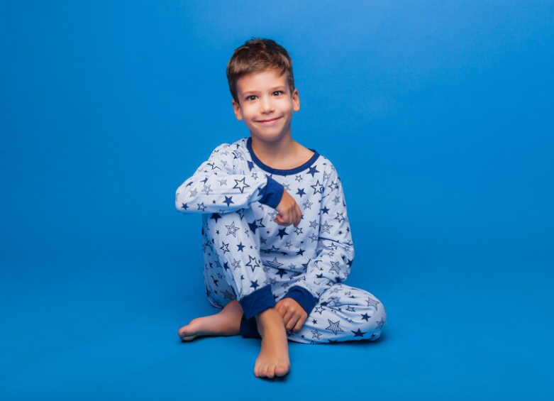 Kid wearing pajamas with a subtle tech patch on the sleeve