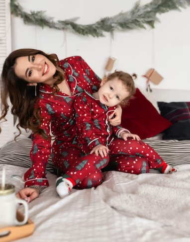 Mom and child in festive pajamas during Christmas