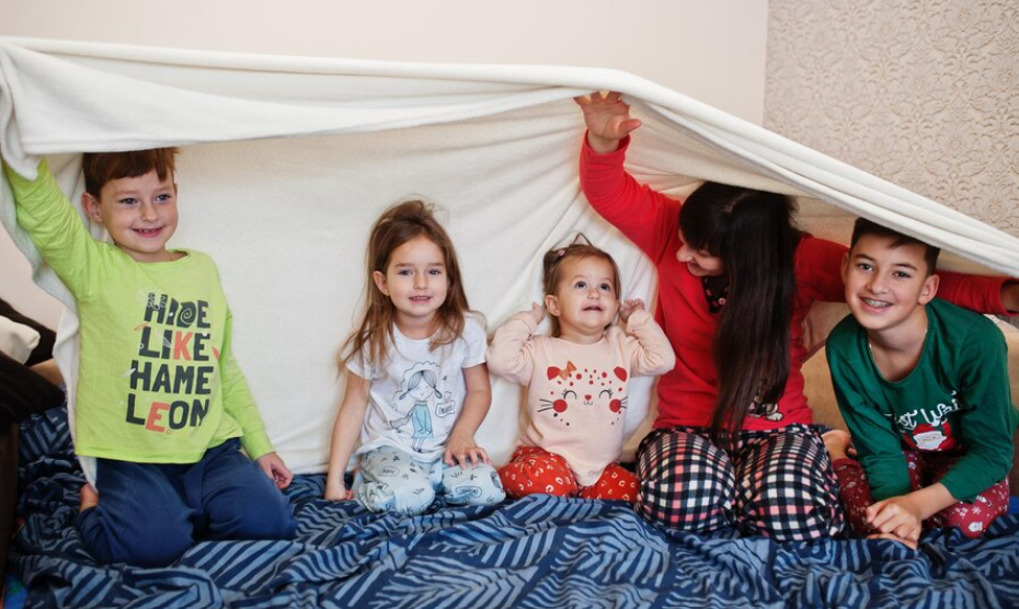 Montage of children from various regions in their traditional sleepwear