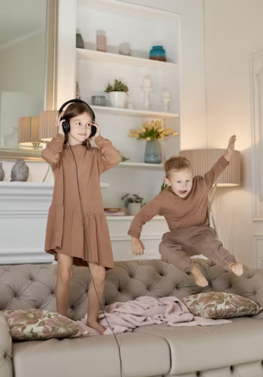 Old photos of children playing in classic sleepwear styles