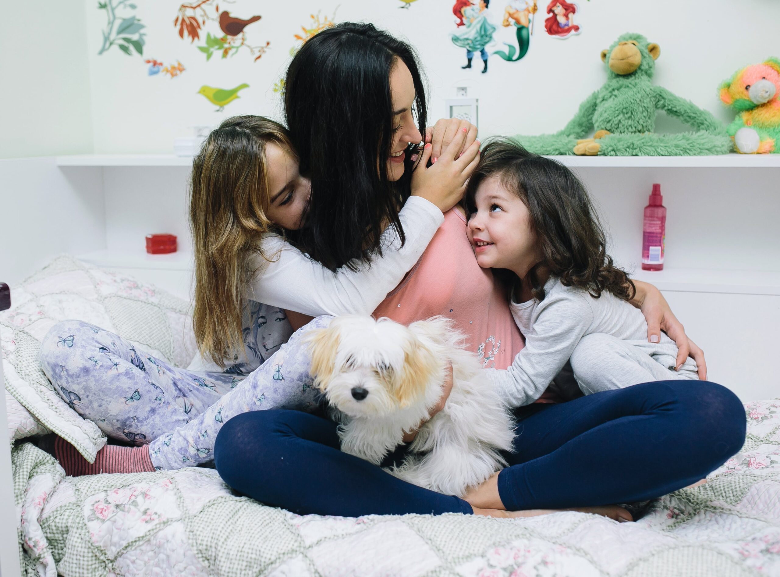 Parent and child, in matching comfort PJs, sharing a heartwarming cuddle