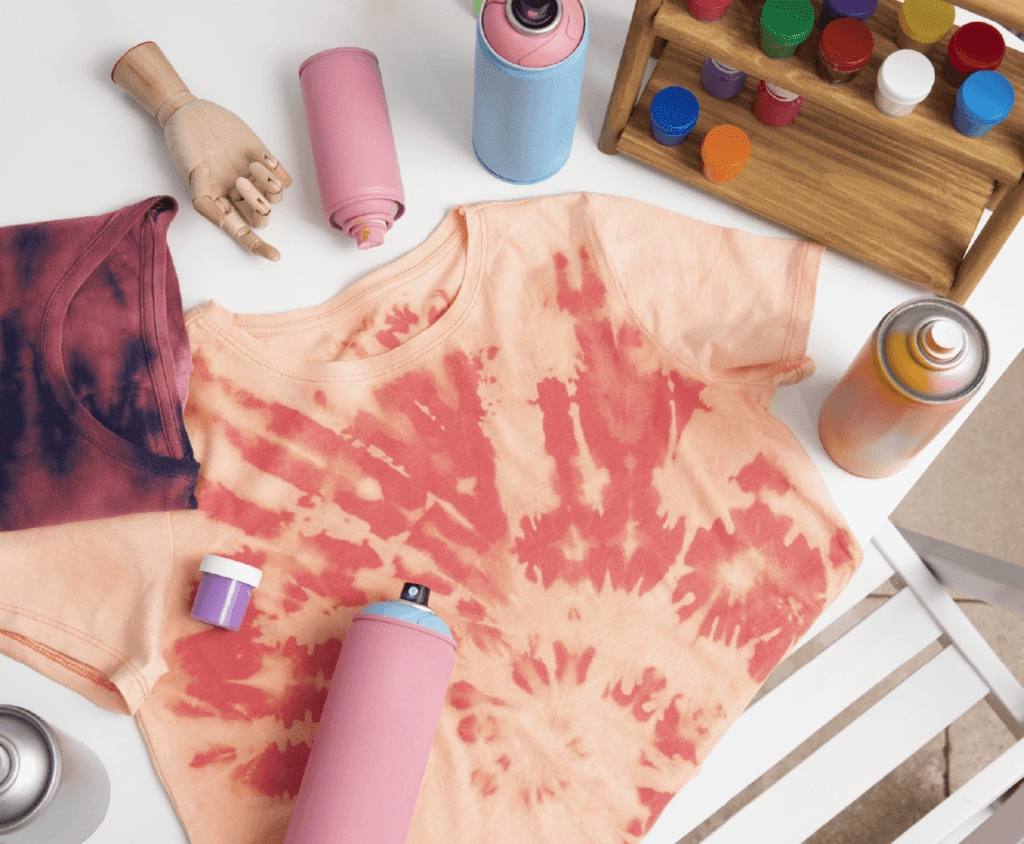 Stenciling a unicorn design onto pajamas using fabric spray