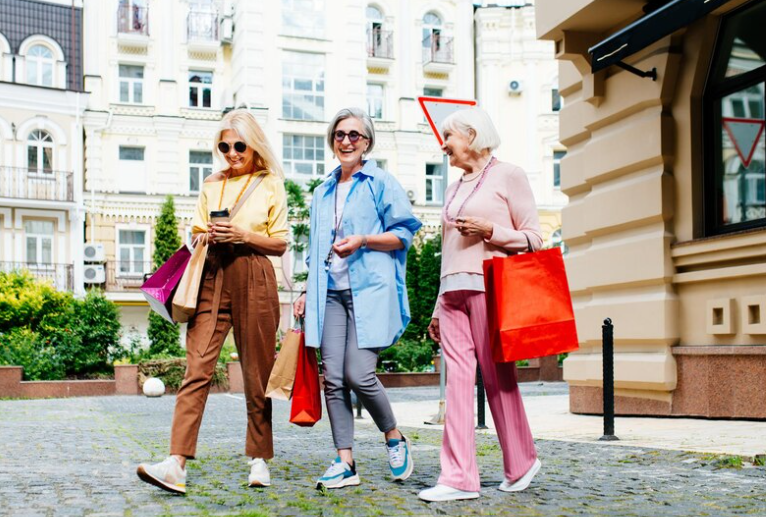 eople of all ages walking down a city street, confidently wearing stylish pajamas