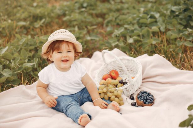 Cute little sitting on a blanket in a park