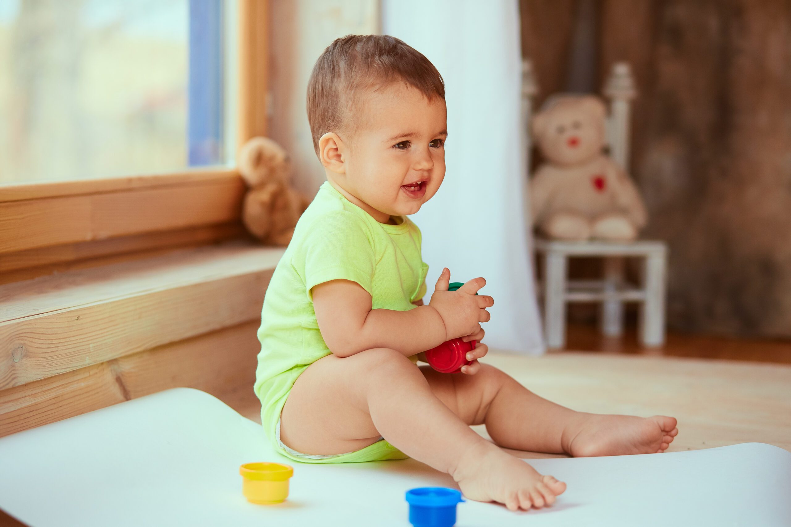 The small baby keeps a box with paints